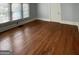 Bright living room features hardwood floors and ample natural light from large windows at 32 Highland Ne Dr, Atlanta, GA 30305