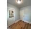 Cozy room with wood-look flooring, shiplap walls, and two white doors at 32 Highland Ne Dr, Atlanta, GA 30305