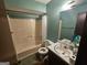 Standard bathroom featuring a shower-tub combo and a single sink vanity at 3244 Harbor Woods Rd, Decatur, GA 30034