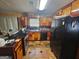 Cozy kitchen featuring multi-tone cabinets, black appliances, and tiled floors at 3244 Harbor Woods Rd, Decatur, GA 30034
