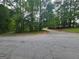 A street view near a wooded area showing the potential for a peaceful and private homesite location at 3244 Harbor Woods Rd, Decatur, GA 30034