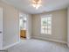 Bedroom with neutral carpeting, a window, and an en-suite bathroom, offering a comfortable and private retreat at 507 Rippling Dr, Temple, GA 30179