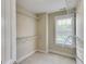 Walk-in closet with white wire shelving and a window, providing ample storage and natural light at 507 Rippling Dr, Temple, GA 30179
