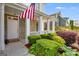 Inviting front porch featuring stone accents, decorative columns, and a well maintained garden at 507 Rippling Dr, Temple, GA 30179