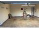 Garage with a water heater, and space for parking and storage, providing functionality and convenience at 507 Rippling Dr, Temple, GA 30179