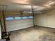 Spacious garage with an automatic door and lighting, providing ample parking and storage space at 507 Rippling Dr, Temple, GA 30179