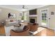 The living room features a stone fireplace, seating and accent furniture for a welcoming aesthetic at 507 Rippling Dr, Temple, GA 30179