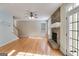 Bright living room with hardwood floors, stone fireplace, and lots of natural light at 507 Rippling Dr, Temple, GA 30179
