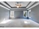 Spacious main bedroom features a trey ceiling, large windows and plush carpeting at 507 Rippling Dr, Temple, GA 30179