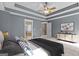 The main bedroom features plush carpeting, trey ceilings, and an ensuite bath with a tub and shower at 507 Rippling Dr, Temple, GA 30179