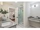 Bright bathroom features a glass-enclosed shower with marble tile and a vanity with modern fixtures at 1000 Arbor Forest Sw Way # 1000, Marietta, GA 30064
