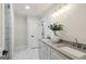 Modern bathroom with double sinks, granite countertops, marble floors, and a sleek walk-in shower, providing a luxurious experience at 1000 Arbor Forest Sw Way # 1000, Marietta, GA 30064