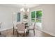 Dining room features hardwood floors, modern chandelier, and abundant natural light at 1000 Arbor Forest Sw Way # 1000, Marietta, GA 30064