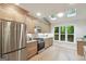 Well-lit kitchen with stainless steel appliances, light wood cabinetry, granite countertops, and a bright, open feel at 1000 Arbor Forest Sw Way # 1000, Marietta, GA 30064