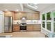 Bright kitchen featuring stainless appliances, light wood cabinetry, granite countertops, and skylights at 1000 Arbor Forest Sw Way # 1000, Marietta, GA 30064