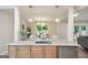 Open kitchen and dining area with granite countertops, stainless steel appliances, and stylish pendant lighting at 1000 Arbor Forest Sw Way # 1000, Marietta, GA 30064