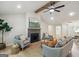 Bright living room features hardwood floors, fireplace, ceiling fan and abundant natural light at 1000 Arbor Forest Sw Way # 1000, Marietta, GA 30064