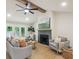Bright living room features hardwood floors, fireplace, ceiling fan and abundant natural light at 1000 Arbor Forest Sw Way # 1000, Marietta, GA 30064