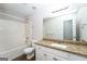 Bathroom featuring granite countertops, white cabinets, and a tub-shower combo at 205 Huntwood Ct, Ellenwood, GA 30294