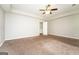 Spacious bedroom with neutral-colored walls, carpet floors and a ceiling fan at 205 Huntwood Ct, Ellenwood, GA 30294