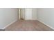 Bedroom with neutral carpeting and a closet, bathed in soft, natural light at 205 Huntwood Ct, Ellenwood, GA 30294