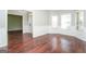 Dining area featuring hardwood floors, detailed trim, and ample natural light at 205 Huntwood Ct, Ellenwood, GA 30294