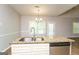 Kitchen featuring stainless steel appliances, island with sink, and stylish granite countertops at 205 Huntwood Ct, Ellenwood, GA 30294