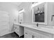 Modern bathroom with dual vanities, large mirrors, quartz counters and tile floors at 378 Grant Park Se Pl, Atlanta, GA 30315