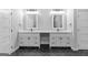 Modern bathroom with dual vanities and black herringbone tile flooring at 378 Grant Park Se Pl, Atlanta, GA 30315