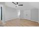 Open bedroom with hardwood floors, double closets, and a ceiling fan at 378 Grant Park Se Pl, Atlanta, GA 30315