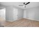 Neutral bedroom featuring light wood floors, ceiling fan, white walls and trim at 378 Grant Park Se Pl, Atlanta, GA 30315