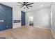 Open bedroom with a fireplace, an accent wall and access to an ensuite bathroom at 378 Grant Park Se Pl, Atlanta, GA 30315