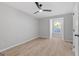 Bright bedroom with light wood floors, fan and a window overlooking trees at 378 Grant Park Se Pl, Atlanta, GA 30315