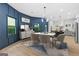 Elegant dining area with a modern light fixture, table with chairs, and access to the renovated kitchen at 378 Grant Park Se Pl, Atlanta, GA 30315