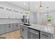 Bright and open kitchen with marble backsplash, stainless steel appliances, and a large island with bar seating at 378 Grant Park Se Pl, Atlanta, GA 30315