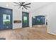 Spacious living room features a modern fireplace, ceiling fan, and large windows overlooking the yard at 378 Grant Park Se Pl, Atlanta, GA 30315