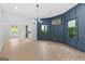 Bright and airy living room featuring hardwood floors, stylish lighting, and large windows with lots of natural light at 378 Grant Park Se Pl, Atlanta, GA 30315