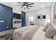 Comfortable main bedroom featuring a fireplace and accent wall at 378 Grant Park Se Pl, Atlanta, GA 30315