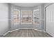 Cozy room featuring a bay window with natural light, complemented by neutral-colored walls and modern flooring at 3941 Kings Pl, Ellenwood, GA 30294