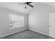 Bedroom features a window, plush gray carpet and neutral walls for comfort at 3941 Kings Pl, Ellenwood, GA 30294