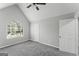 Bedroom features a large window, closet, and soft gray carpet at 3941 Kings Pl, Ellenwood, GA 30294