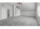 Spacious bonus room with gray carpet and neutral walls, offering versatile living at 3941 Kings Pl, Ellenwood, GA 30294