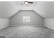 Bright bonus room with gray carpet and ceiling fan offers flexible living space at 3941 Kings Pl, Ellenwood, GA 30294
