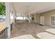 Open covered patio featuring beautiful stone floors and ample space for outdoor enjoyment at 3941 Kings Pl, Ellenwood, GA 30294