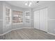 Bright dining room with large windows overlooking the backyard and a traditional light fixture at 3941 Kings Pl, Ellenwood, GA 30294