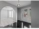Inviting entryway with decorative glass front door and an arched opening into the adjacent living space at 3941 Kings Pl, Ellenwood, GA 30294