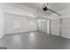 Spacious two car garage with light gray floors and two windows for natural light at 3941 Kings Pl, Ellenwood, GA 30294