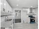 Modern kitchen with white cabinets, granite countertops, stainless steel appliances, and tiled backsplash at 3941 Kings Pl, Ellenwood, GA 30294