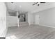 Spacious living room with hardwood floors, staircase, and modern color pallete at 3941 Kings Pl, Ellenwood, GA 30294