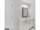 Bathroom with a vanity, mirror, and good lighting at 152 Creekrise Pl, Palmetto, GA 30268